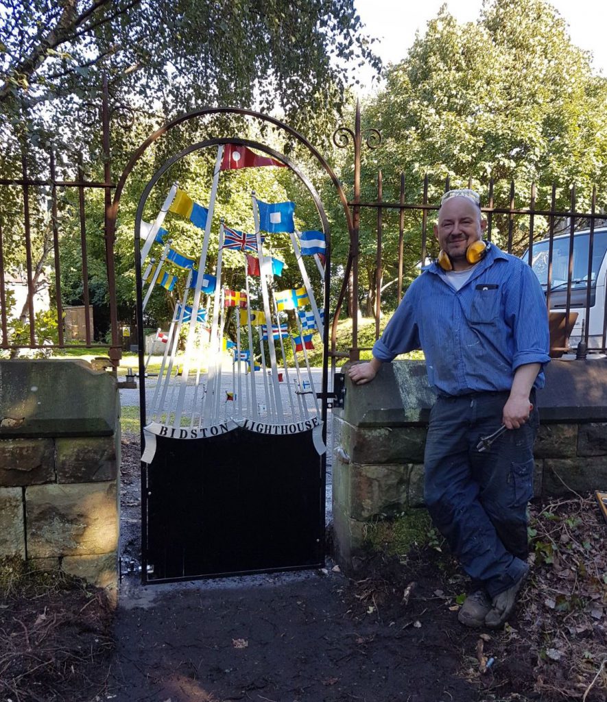 Blacksmith Alex Price by the newly installed gate to Bidston Lighthouse, on 15th September.