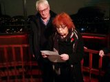 Eileen Willshaw reading from Wilfred Owen. Charlie Warren looks on.